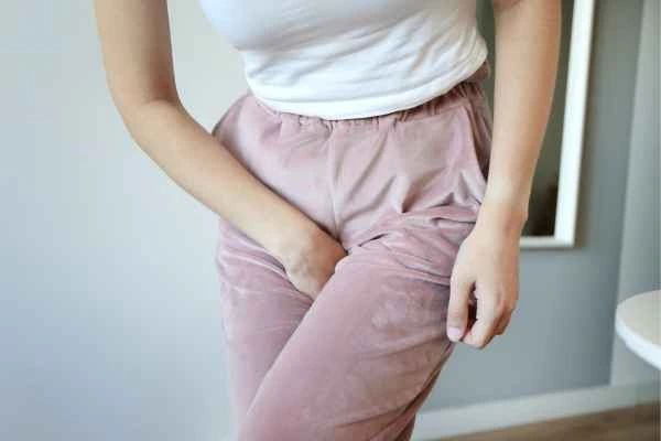 woman struggling with urine incontinence Longbridge